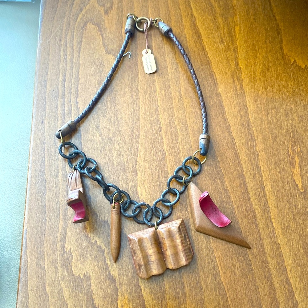 Leather & wood necklace w/ 4 wooden pendants: school desk, pencil, book, desk.